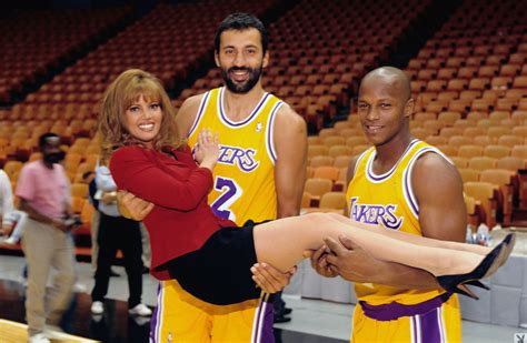 The picture, which was taken for a Sports Illustrated cover story that ran in the Nov. 2, 1998 issue, features Jeanie lying nude with two basketballs placed strategically on her chest along with ...
